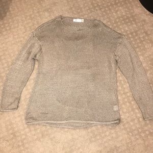 Tan sweater with cutouts on the back
